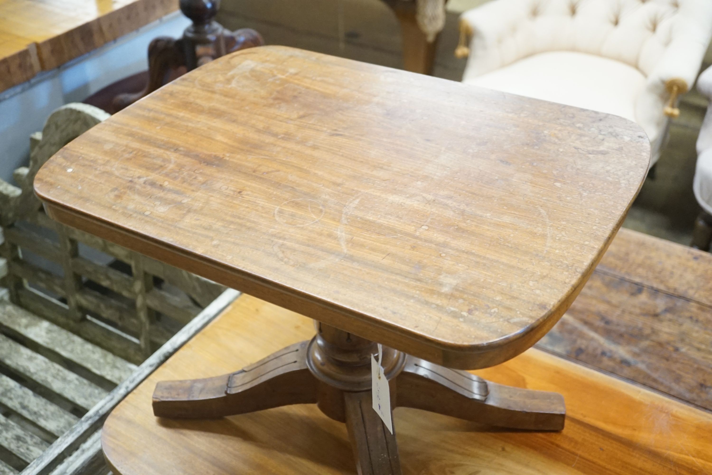 A miniature mahogany tablet-topped table, width 56cm depth 40cm height 38cm